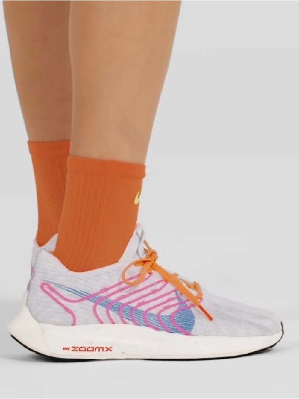 Nike White Running Shoes with Pink & Blue Knit Accents and Orange Laces